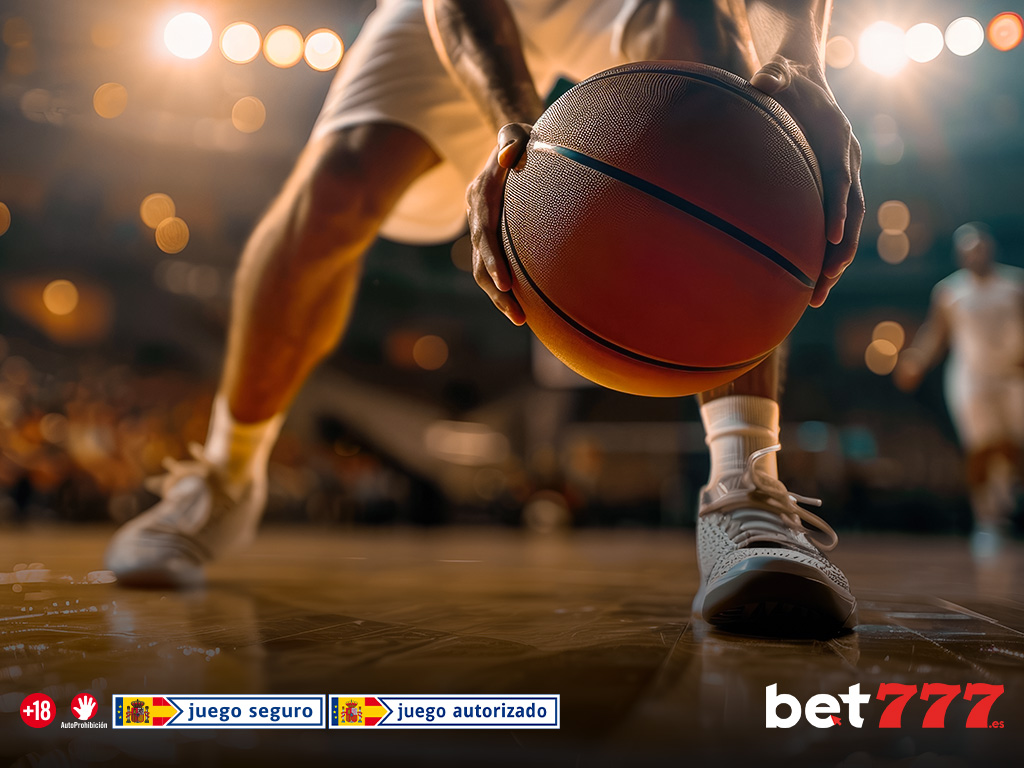 Jugador de baloncesto botando el balón durante un partido.Jugador de baloncesto botando el balón durante un partido.